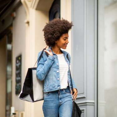 Woman shopping looking at storefront